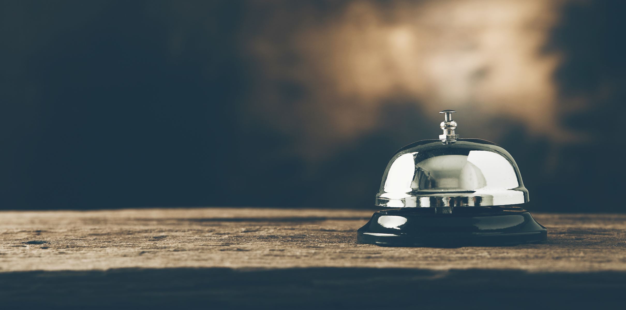 close up of a small alert bell sitting on a table